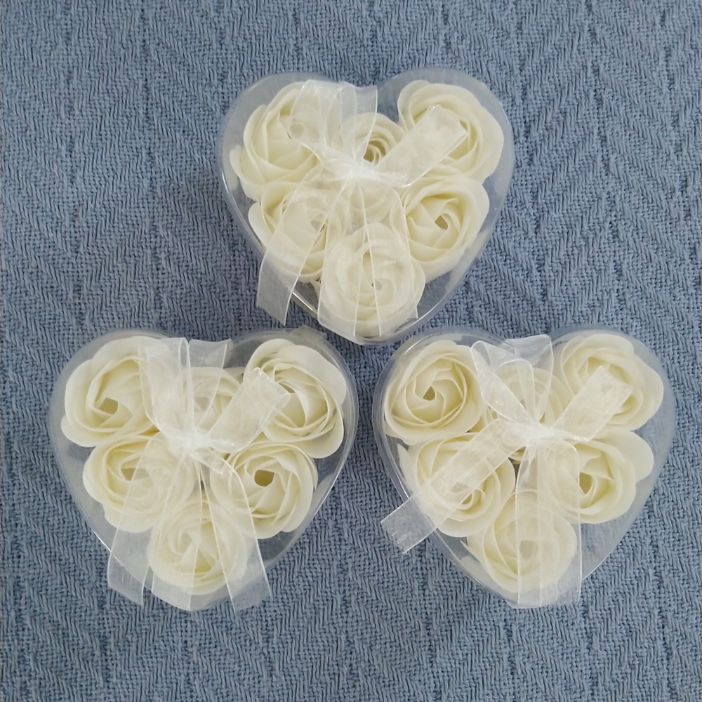 Rose petal soaps in white. Set of 3 hearts, each containing 6 soaps.